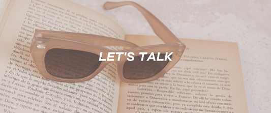 let's talk with a book and sunglasses background 