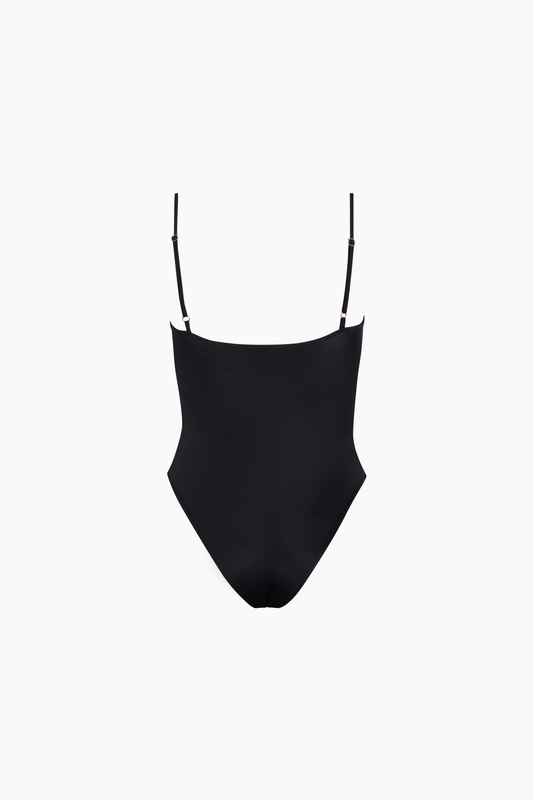 A black one-piece swimsuit with a deep V-neckline and thin adjustable straps.